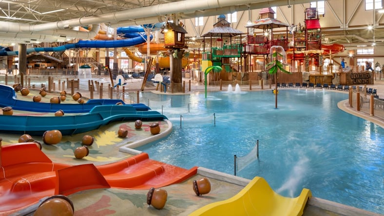 kid rides down waterslide