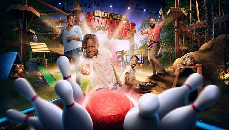 Family enjoying bowling and ropes course