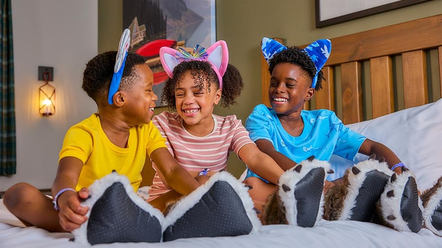 kids having fun on the bed before checkout