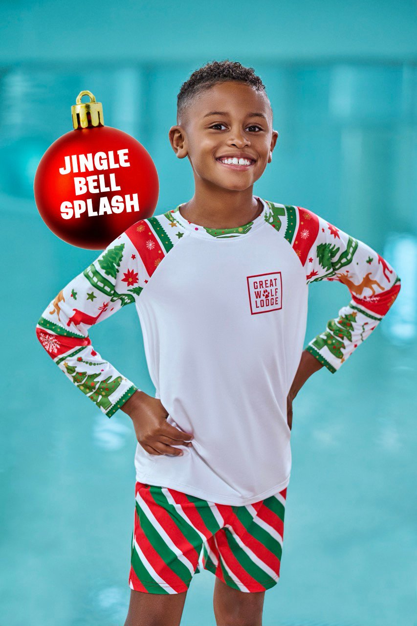 a boy wearing a christmas themed swimwear