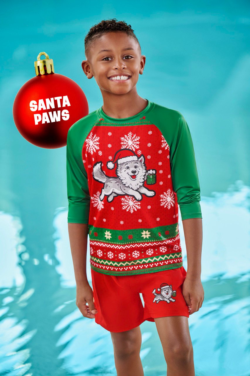 a boy wear a santa themed swimear in red and green