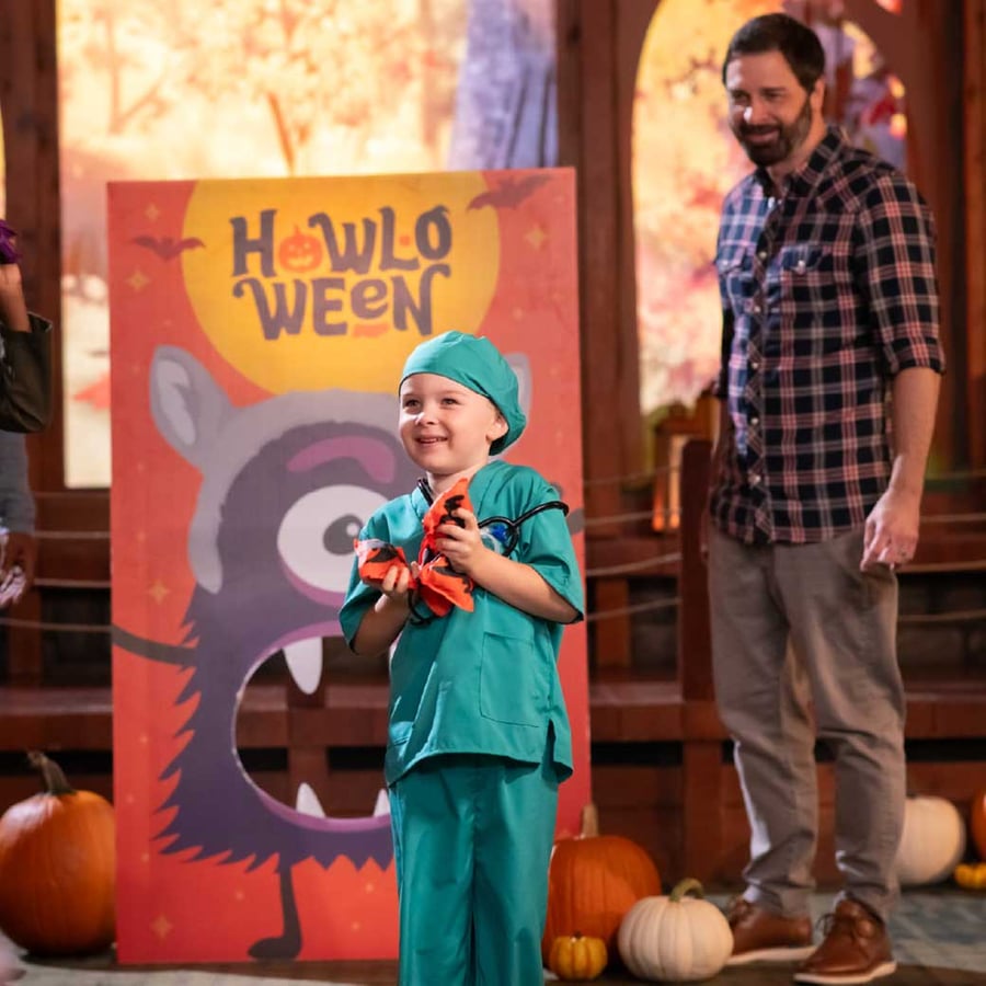 Mother and daughter playing pin the wolf ears