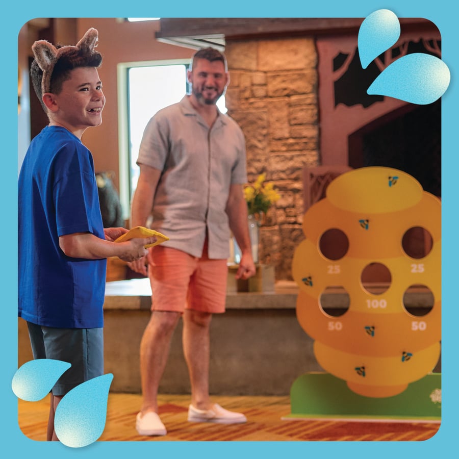 Father and son enjoying games at Great Wolf Lodge