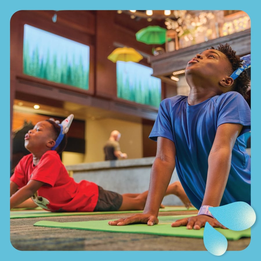 Two kids stretching during yoga activity