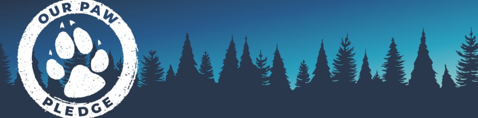 tree skyline with Our Paw Pledge circle banner with paw inside to left