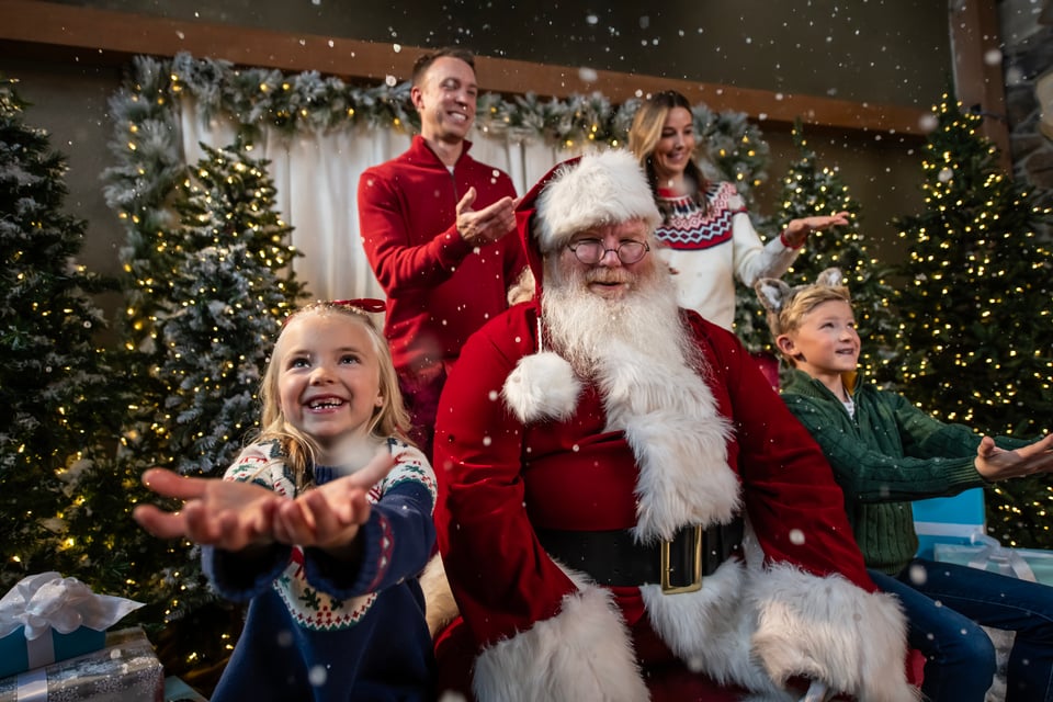 family clicking a pic with Santa
