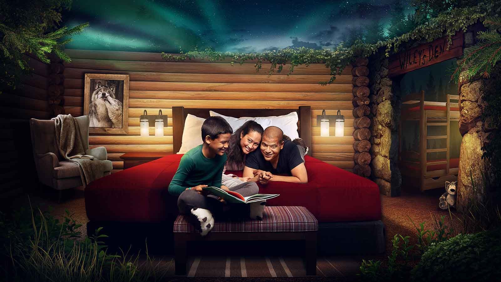 Family reading a book in a wolf den suite