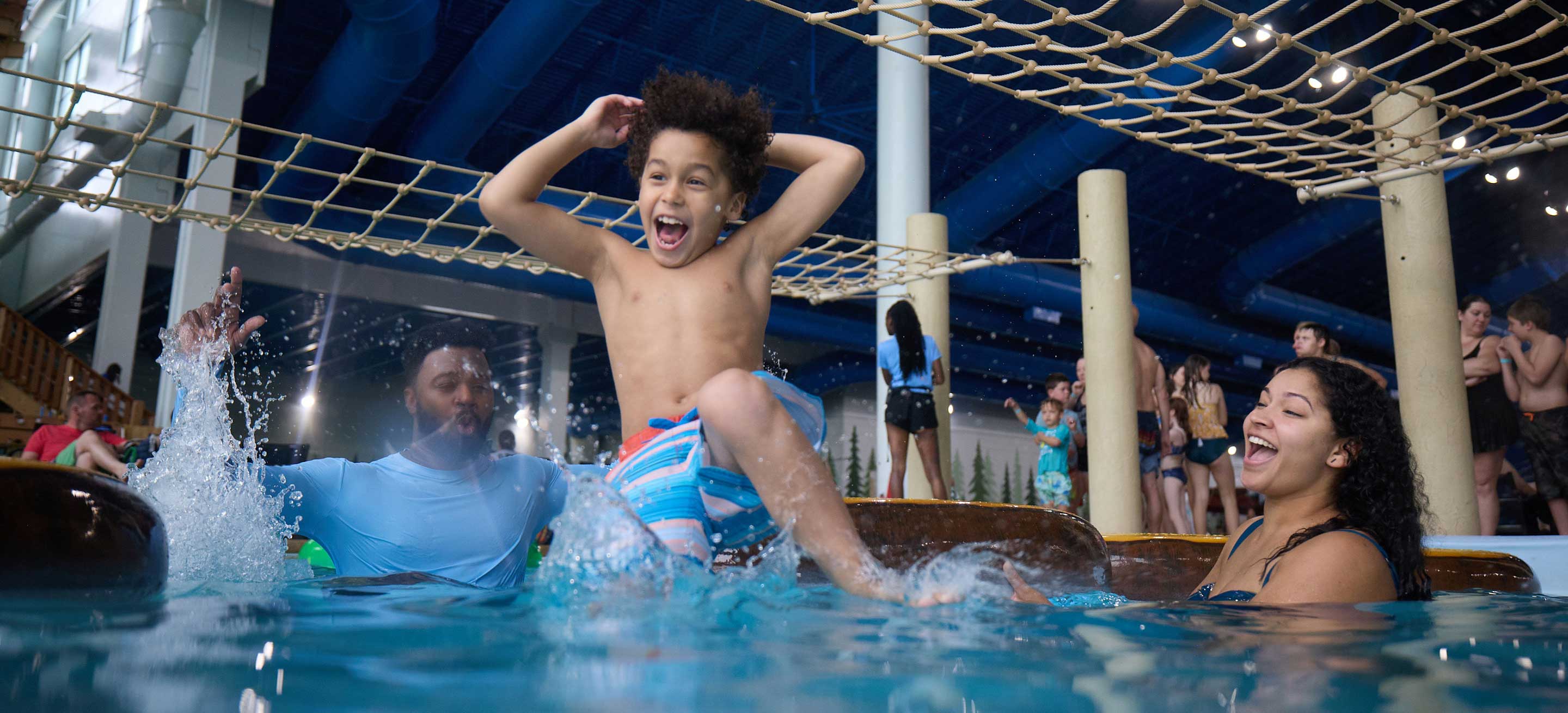 Kid jumping  into the pool