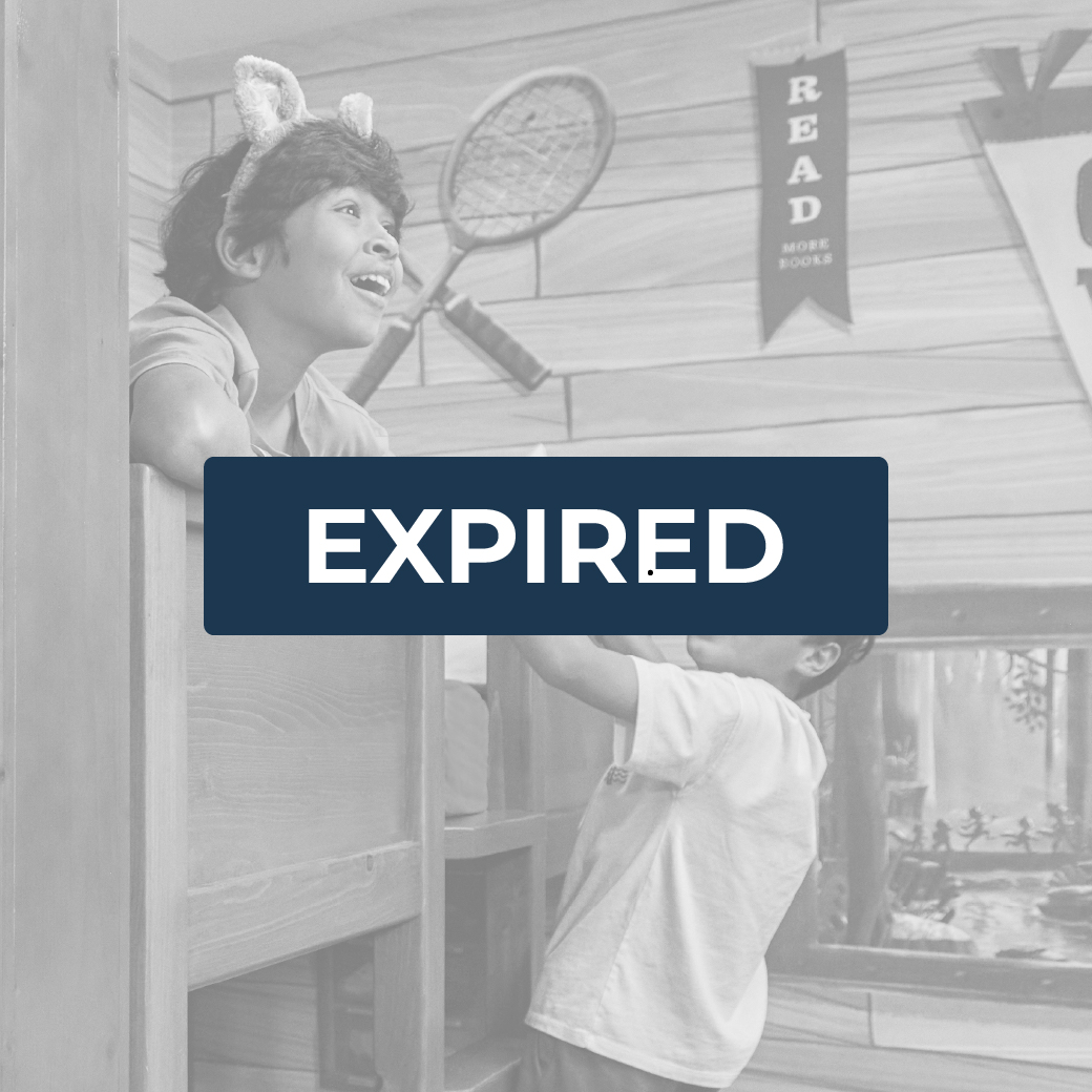 boy climbing on a bunk bed as the other kid watches
