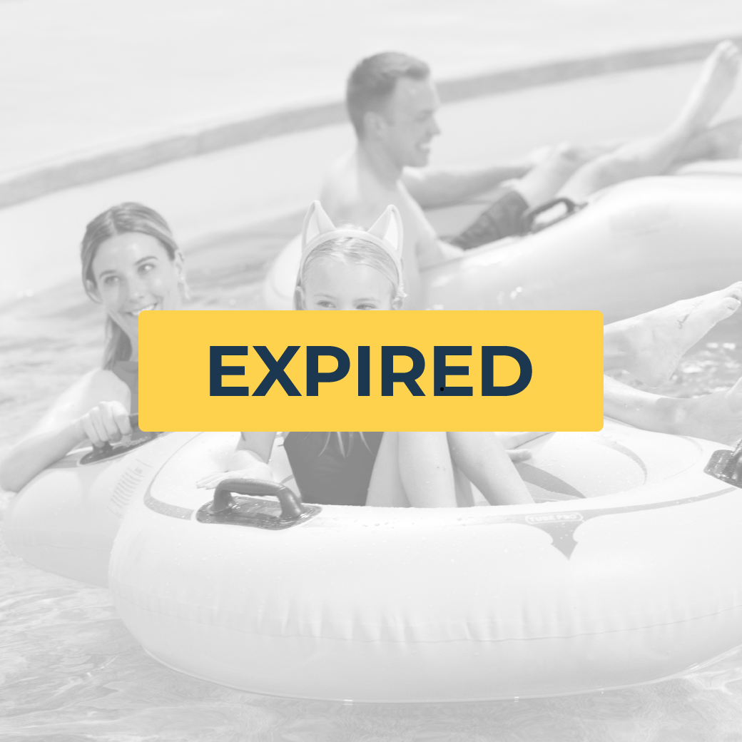 family floating in lazy river water ride using tubes