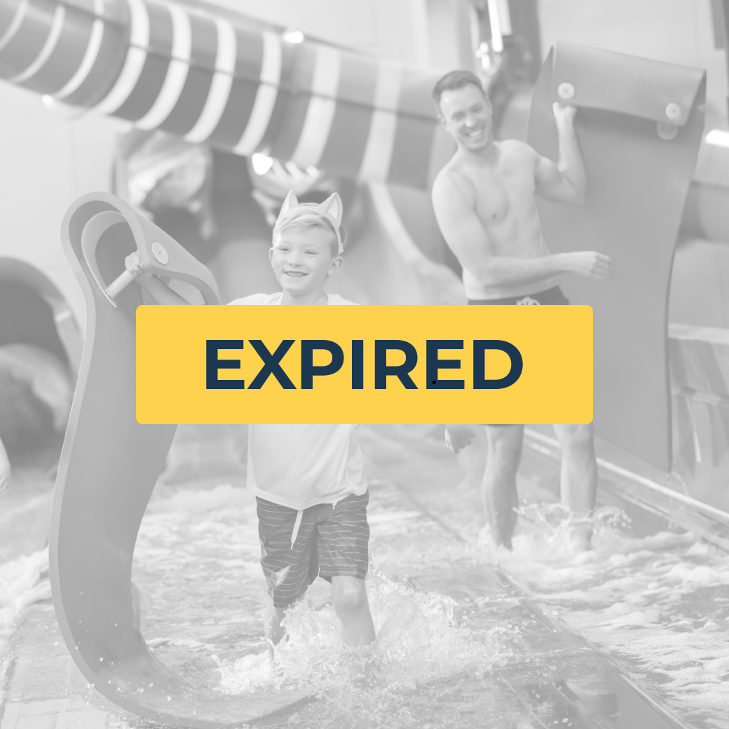 father and son sliding down a water slide using rubber mats