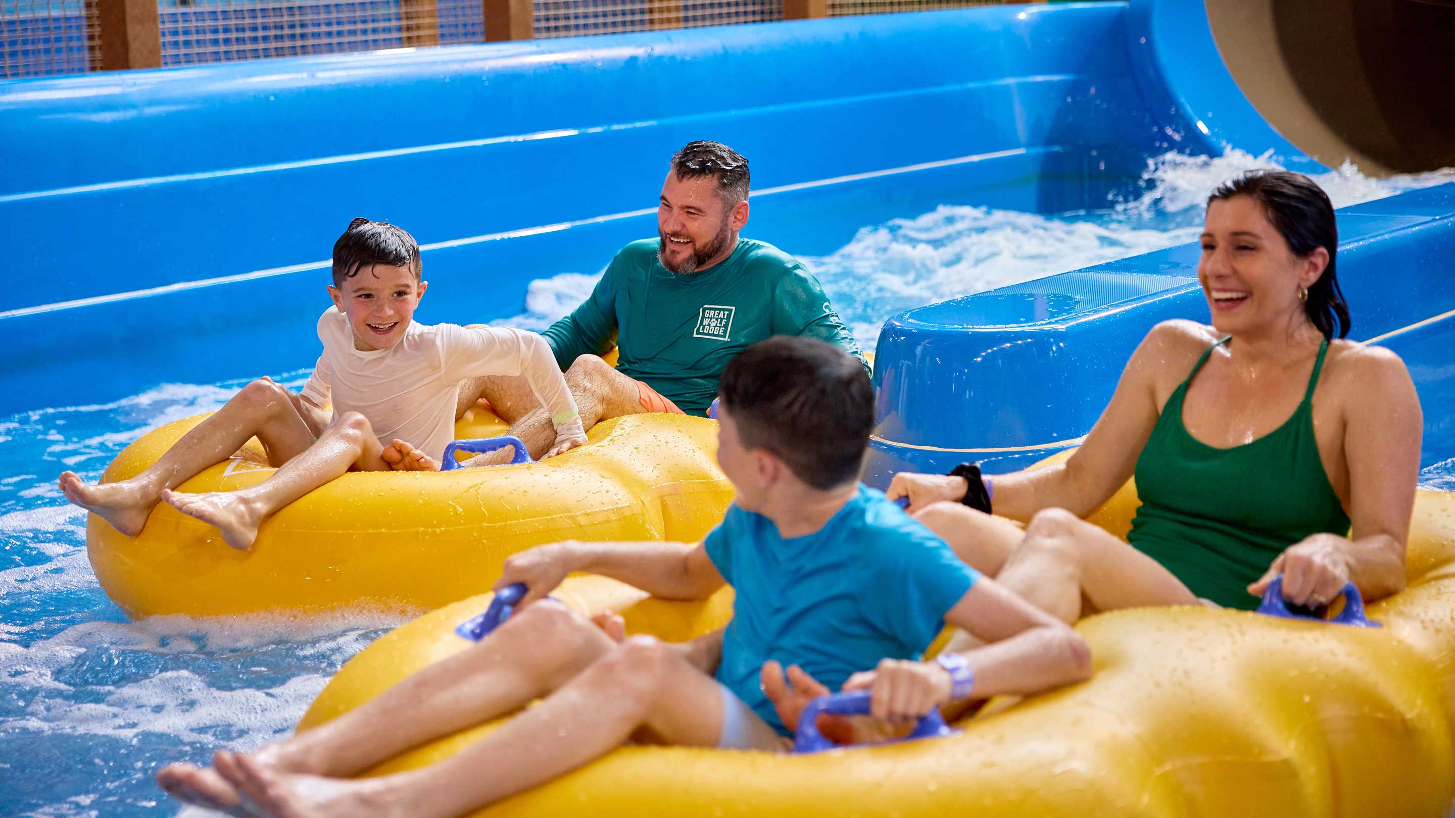 Dad and son on a water slide