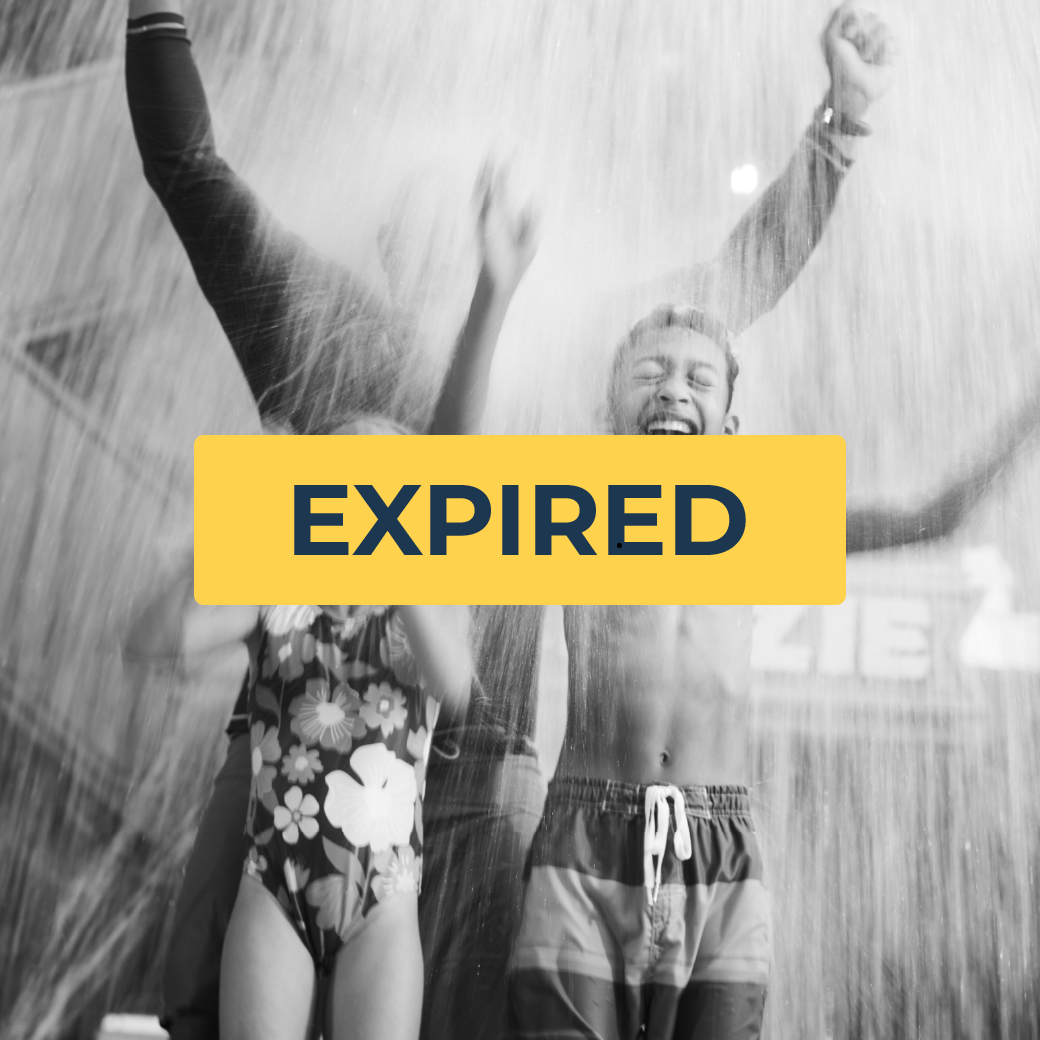 kids enjoy with father as they get soaked in water dropped from the top