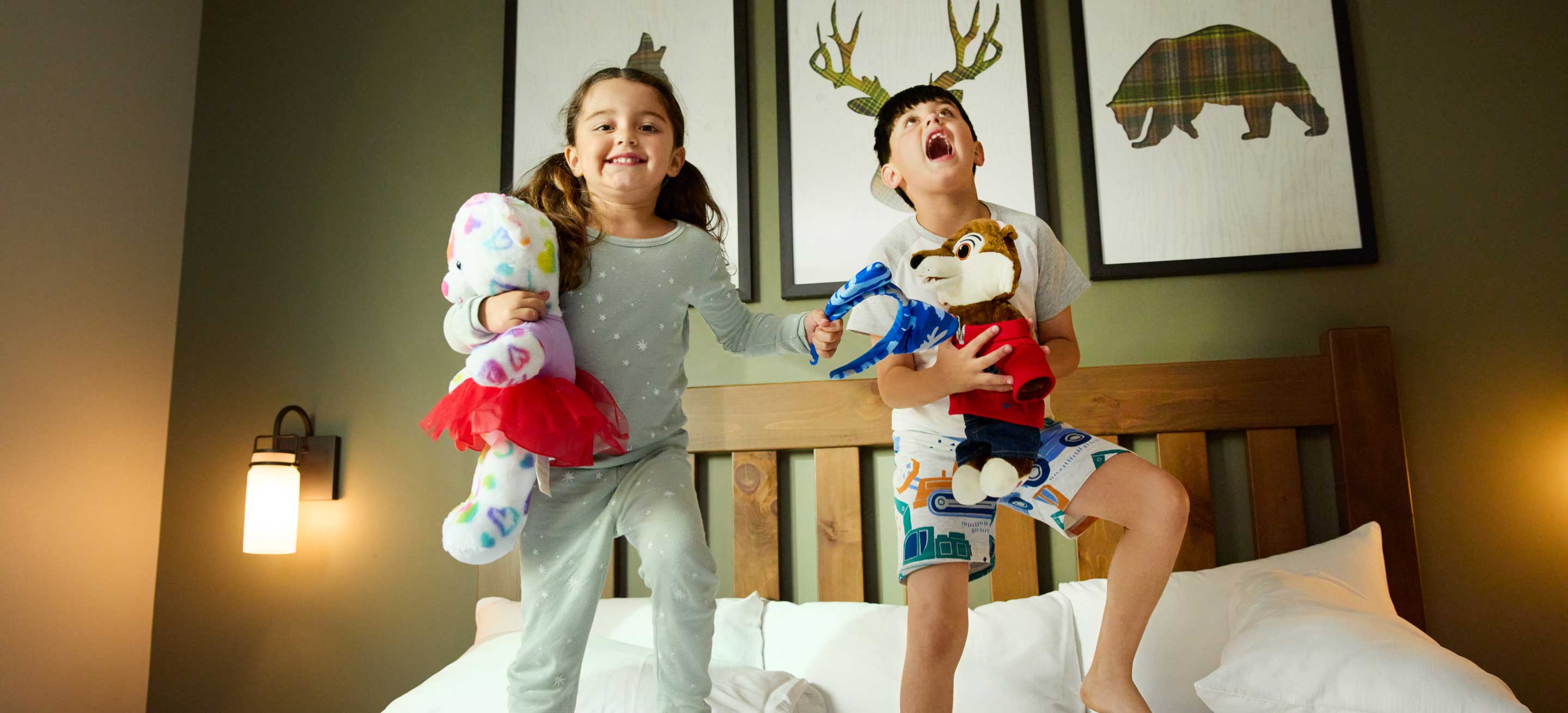 Kids jumping on a bed