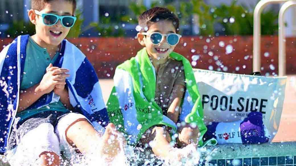 Two boys enjoying outdoor water park at great wolf lodge