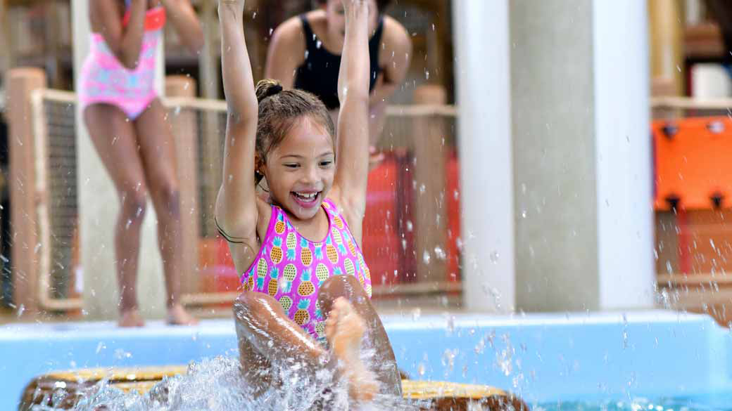 Little girl enjoying a water indoor park 