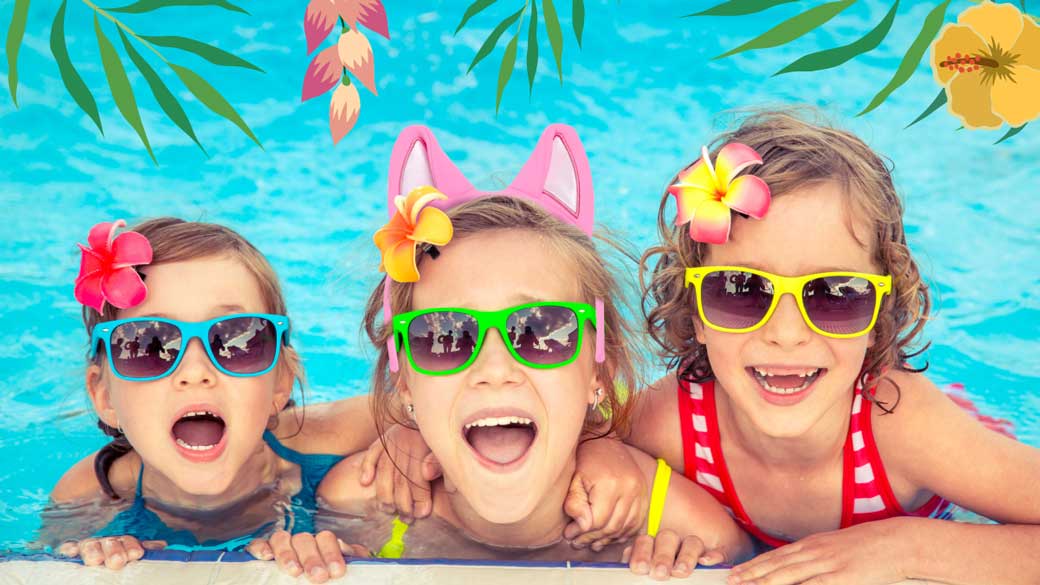Three little girls wearing glasses in a pool