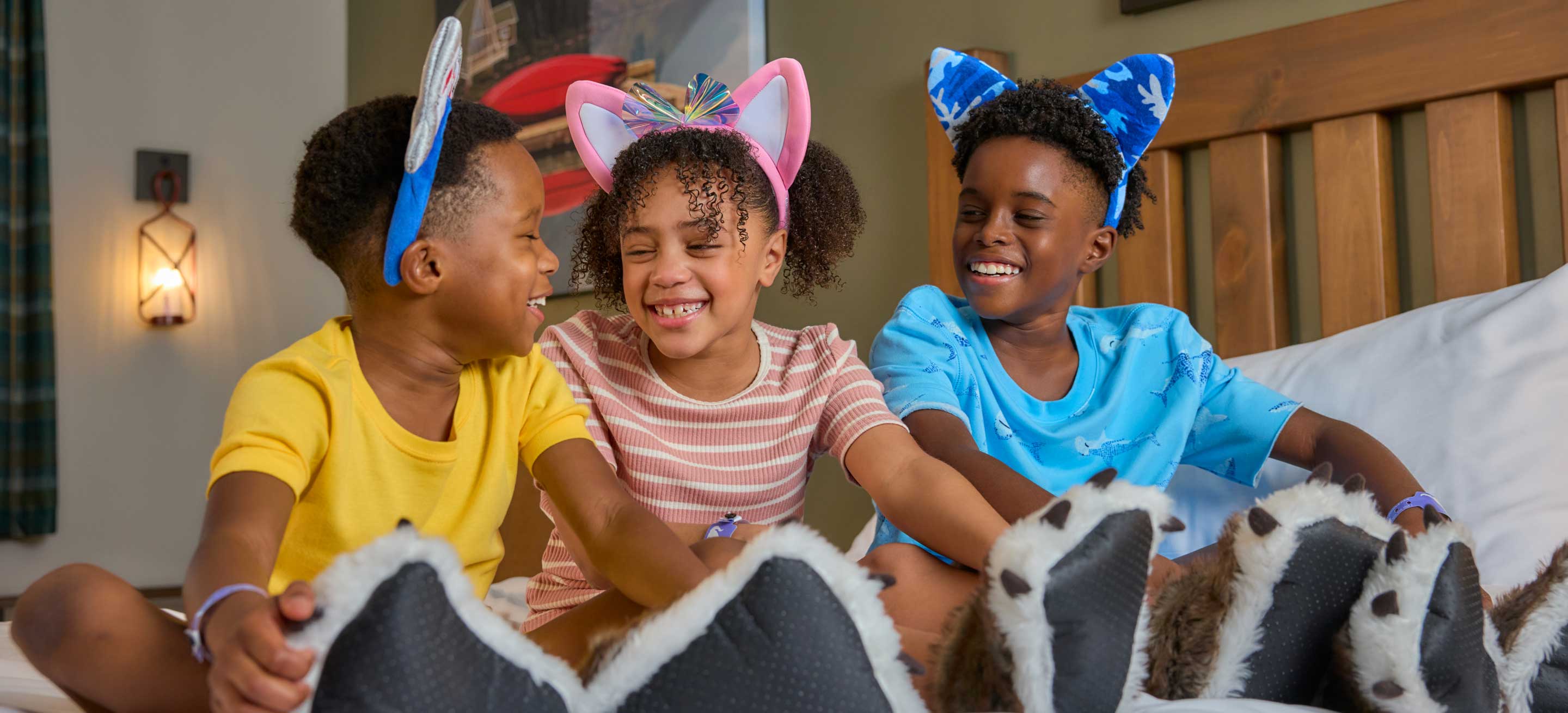 kids sitting on bed and smiling