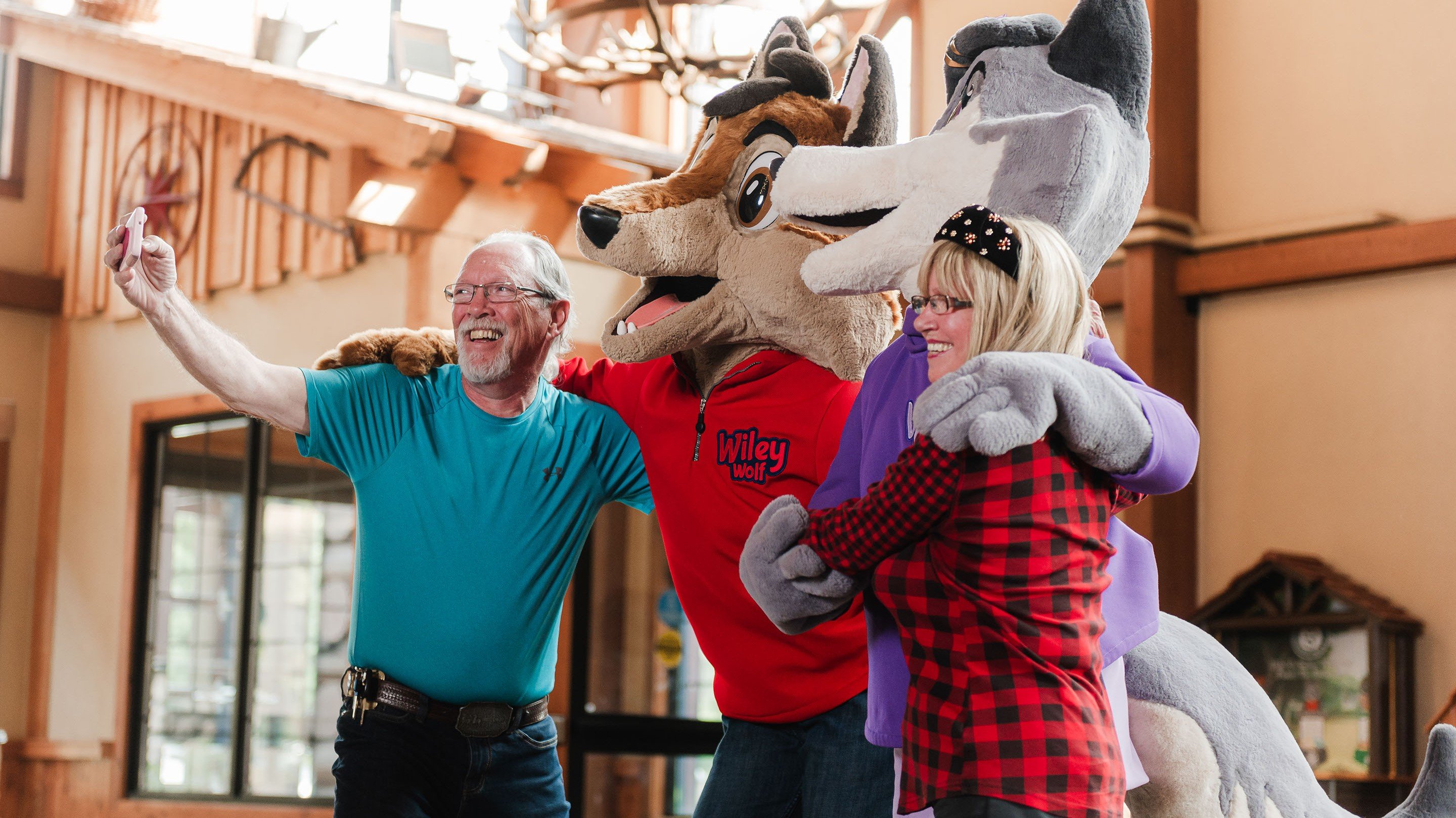 Mascot posing with a family