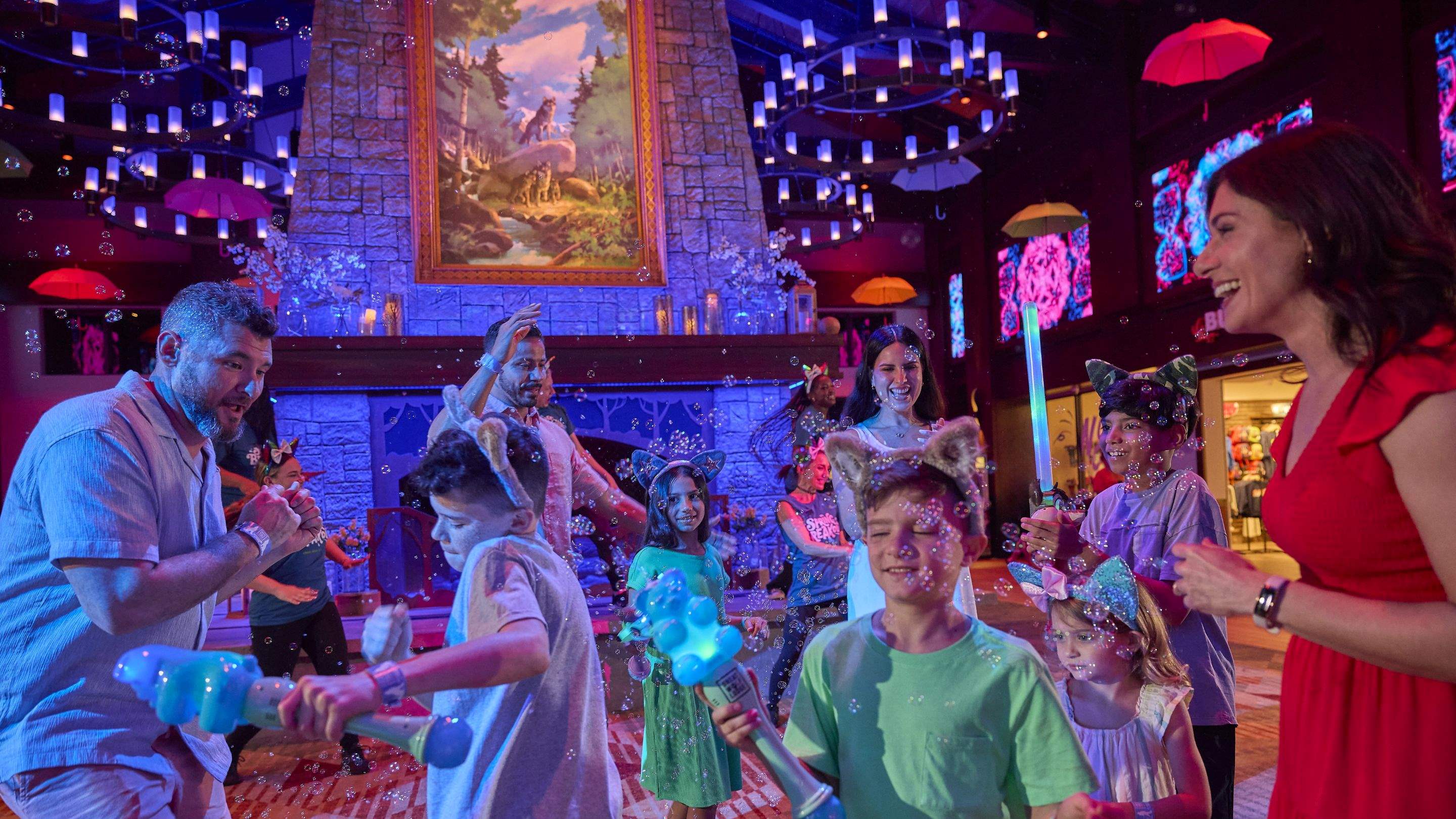 A family dancing and playing with bubbles in a fun setting