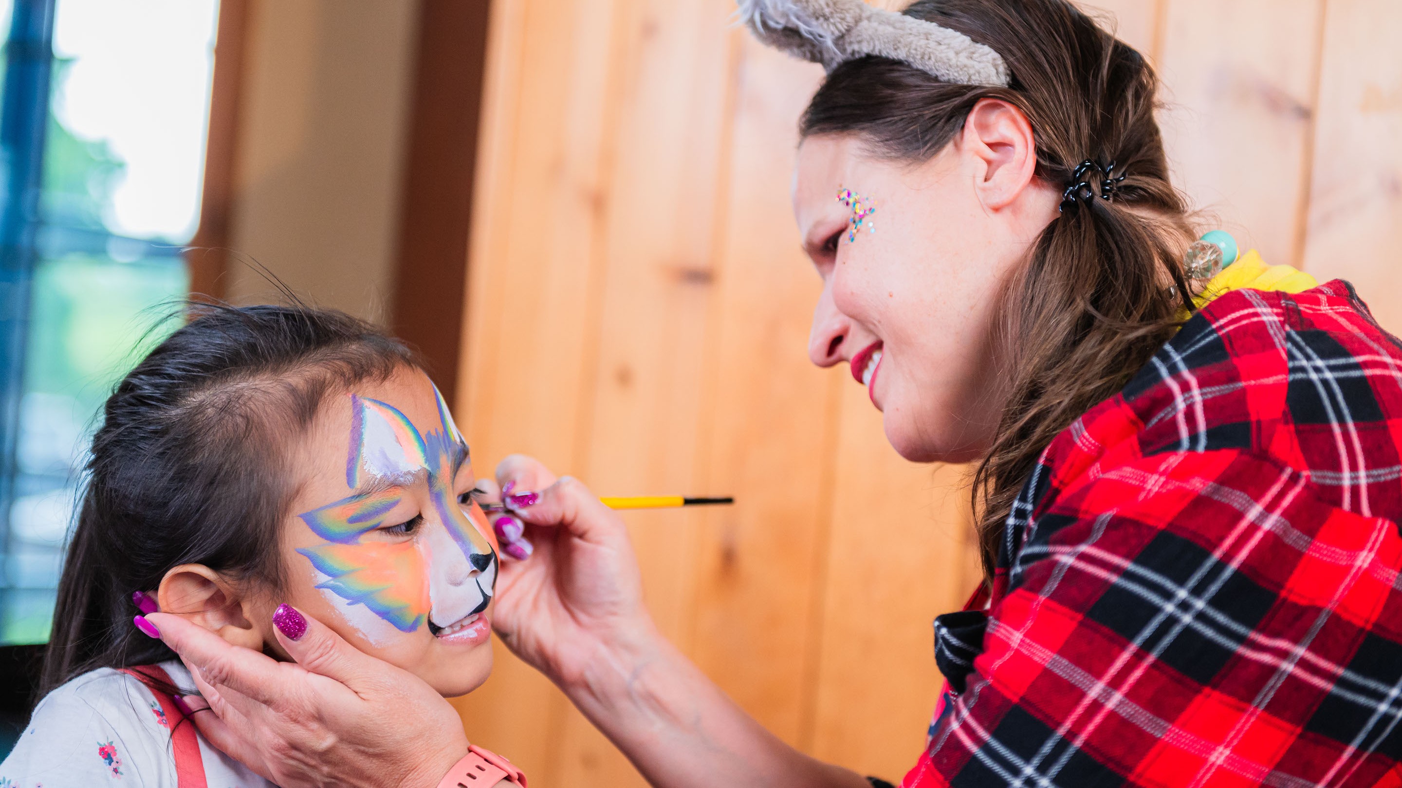 Artist painting child’s face