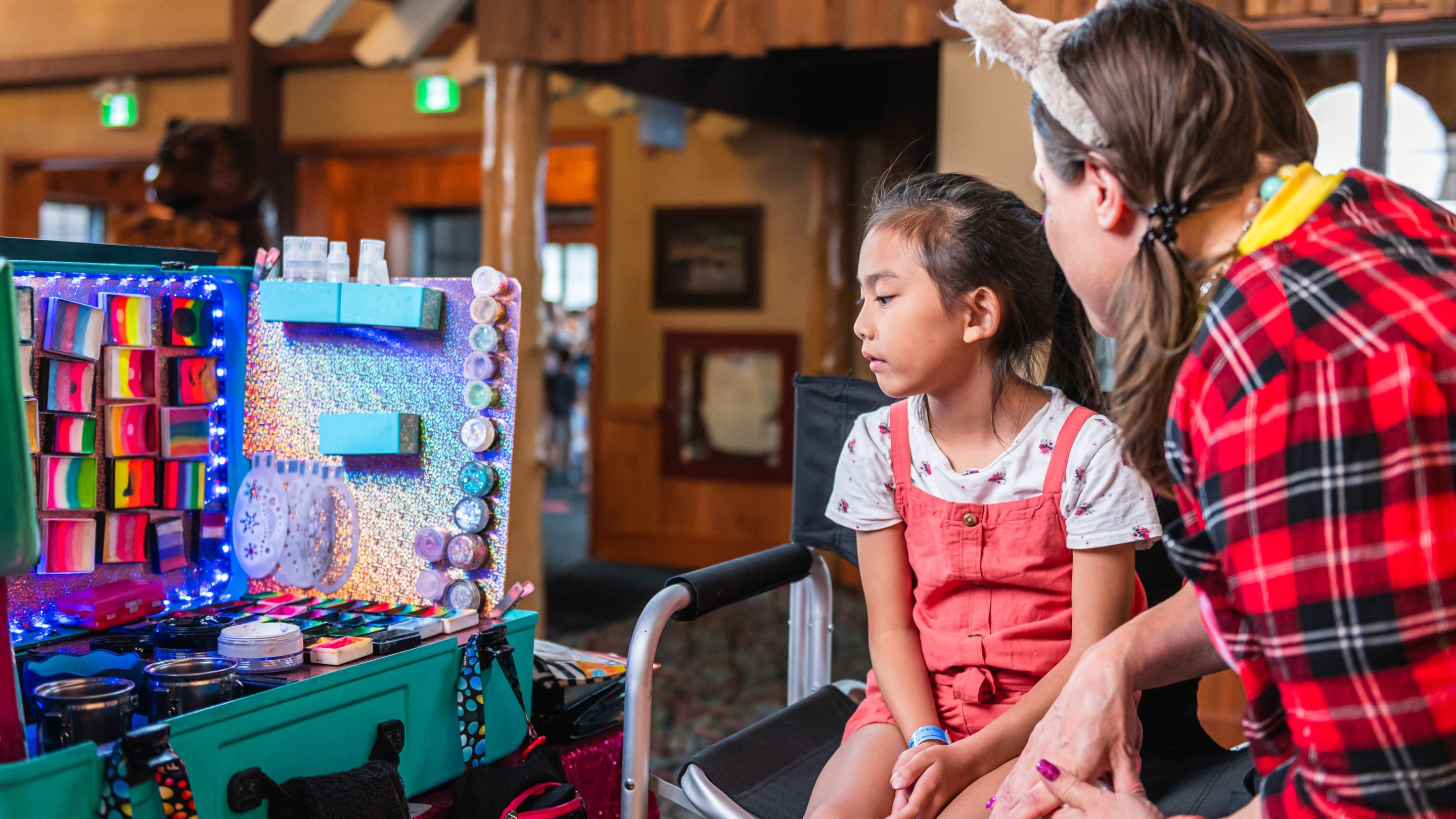 Child choosing face paint design