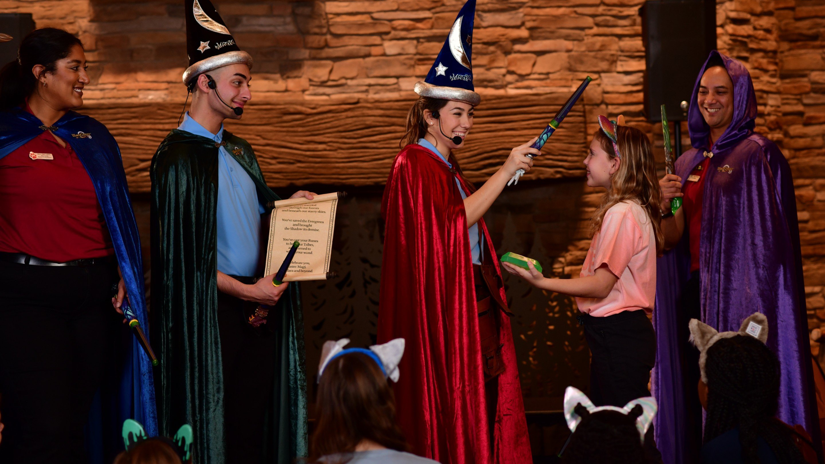 Girl participating in wizard ceremony at Great Wolf Lodge