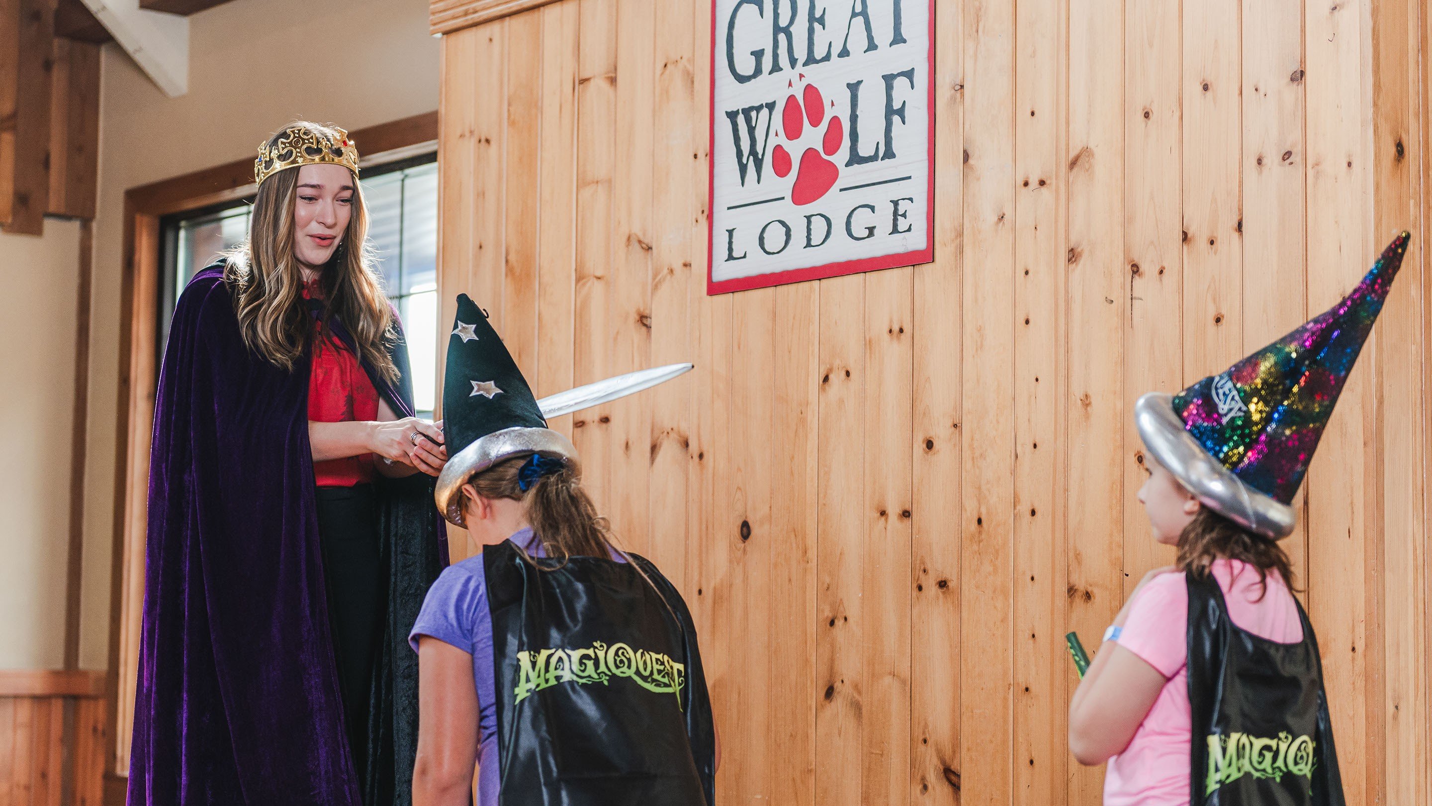 Woman knighting child at Great Wolf Lodge