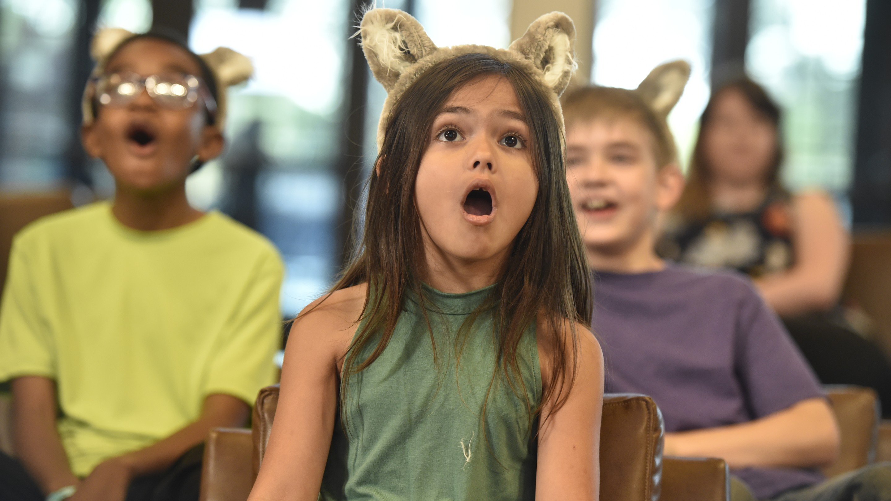 kids excited as they watch a movie