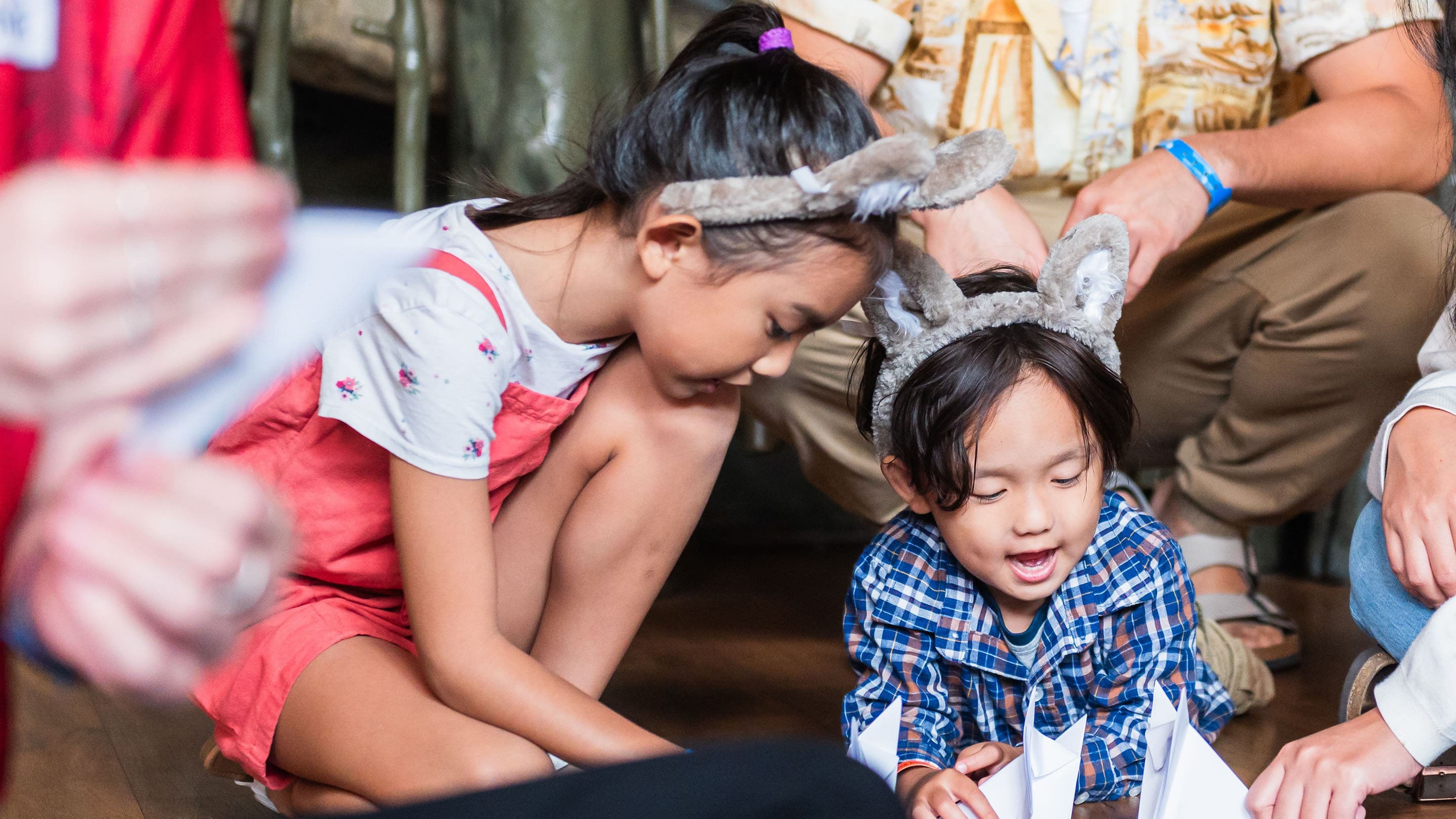 Children looking at some cards for the Wolf Walk event