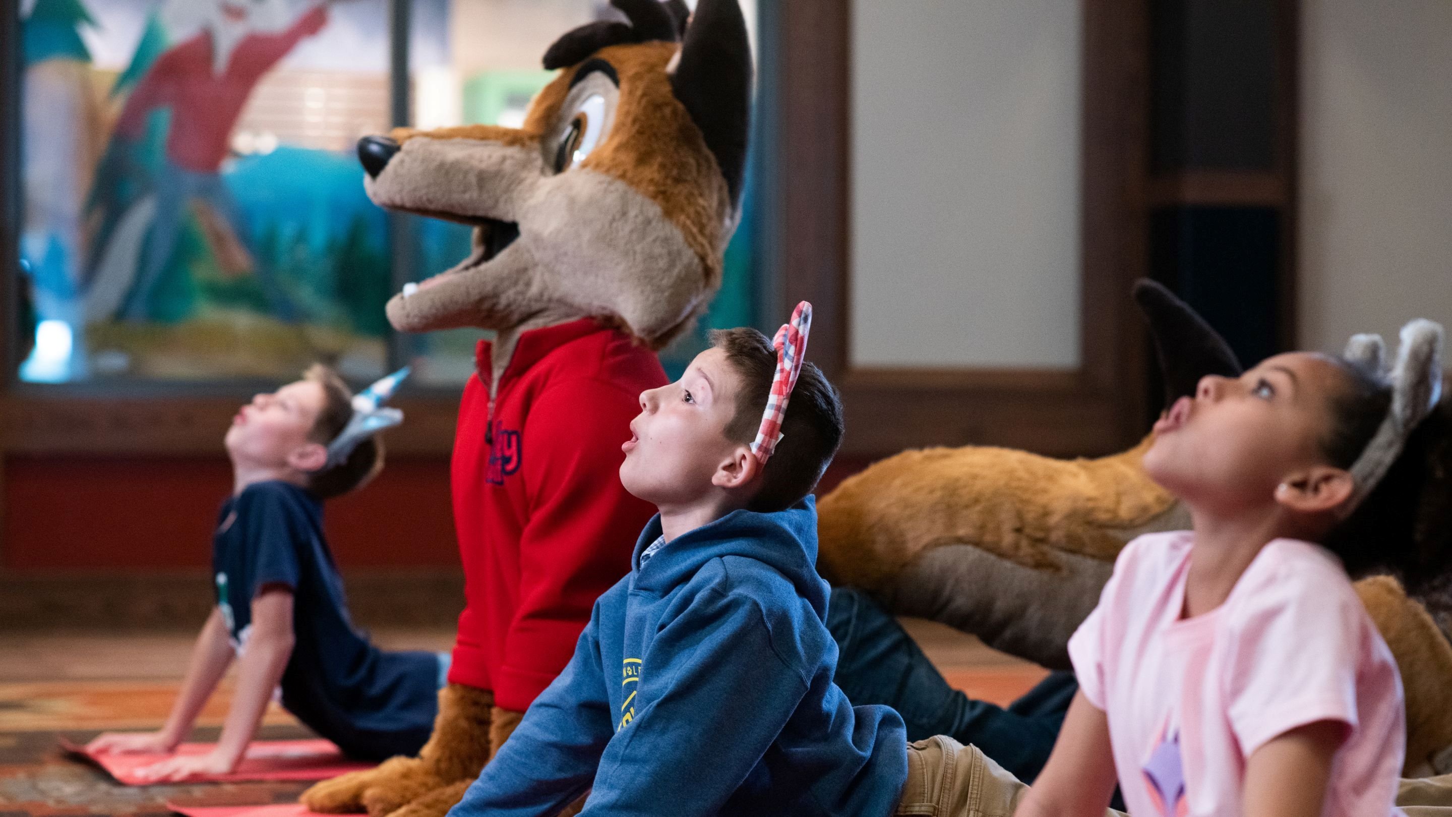 children doing yoga with great wolf lodge characters