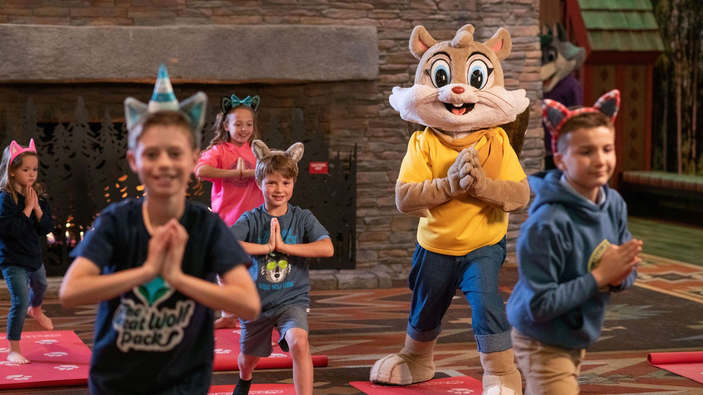 Guest doing yoga with great Wolf Character