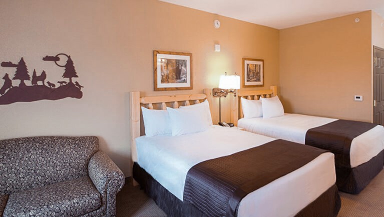 The beds and sofa in the Grand Bear Suite