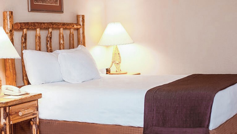 The Queen bed of the Accessible Queen Suite at Great Wolf Lodge Grand Mound, WA.