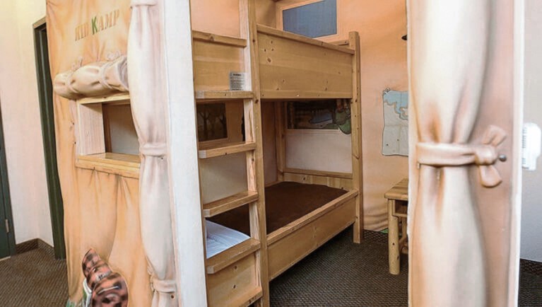 The bunk beds in the indoor tent in the KidKamp Suite