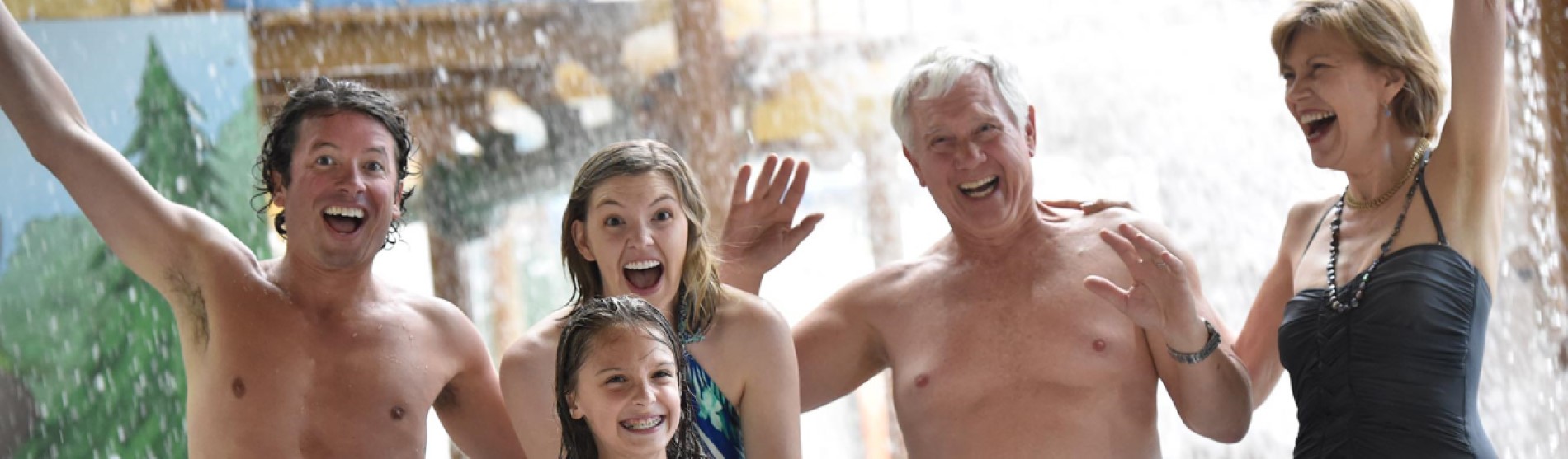 Family pose for a picture at a water park