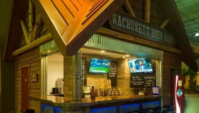 Catch a game, play games, and enjoy local craft brews and Wachusett Brew Barn