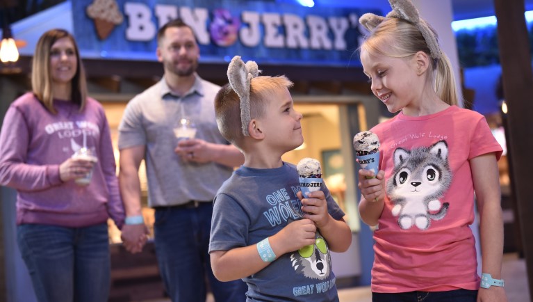 A family enjoying Ben & Jerry's ice cream at Great Wolf Lodge indoor water park and resort.