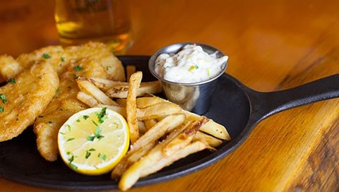 A plate of fish and chips available at Loose Moose Bar & Grill at Great Wolf Lodge indoor water park and resort.