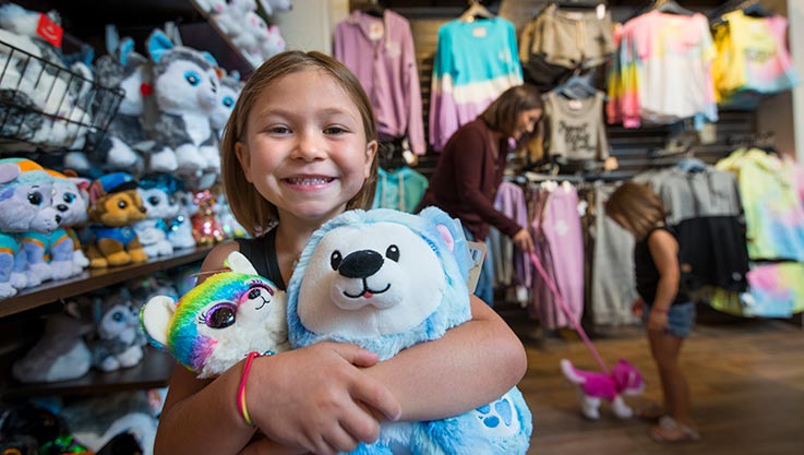  A small girl shopping at Buckhorn Exchange at Great Wolf Lodge indoor water park and resort.