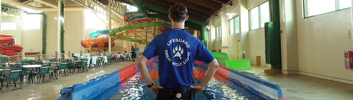 lifeguard stands in front of the indoor water park and pool.