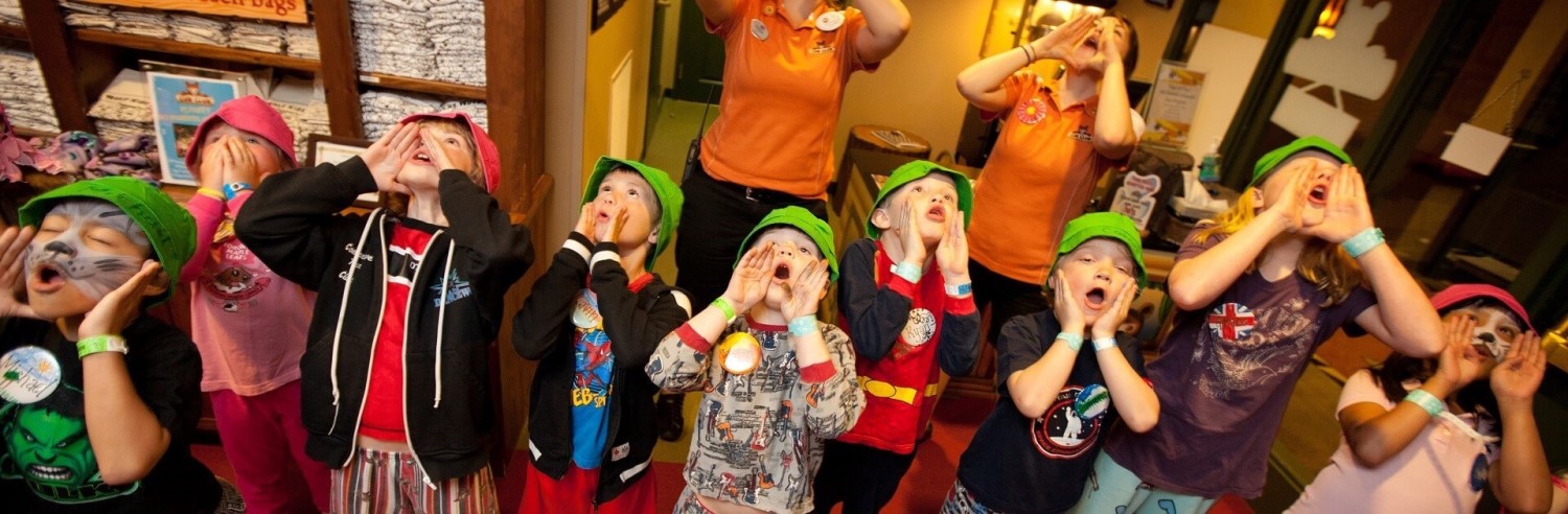 A group of kids are lead by Great Wolf Lodge employees in a wolf howl at Great Wolf Lodge indoor water park and resort.