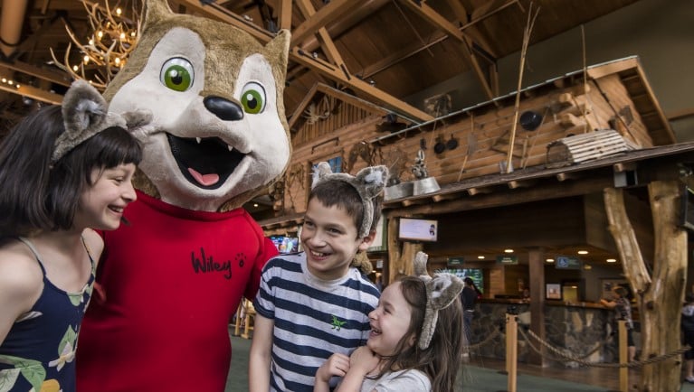3 kids in wolf ears smile with an original character