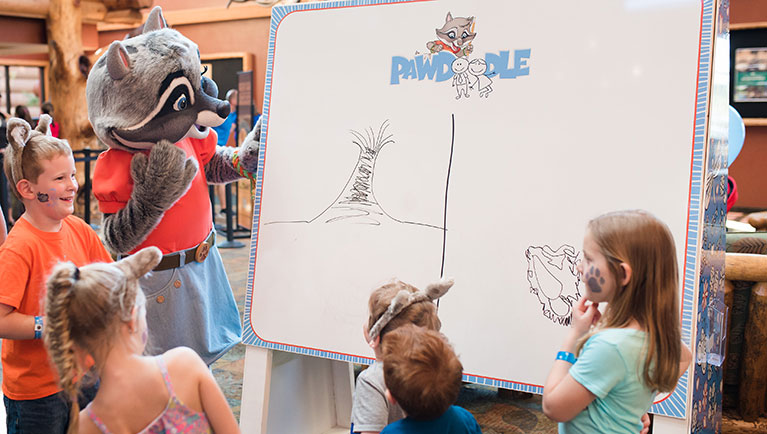 Kids wearing wolf ears and an original character playing Pawdoodle