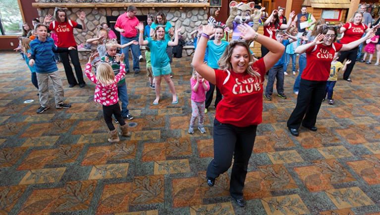 Great Wolf Lodge pack members lead guests in a dance