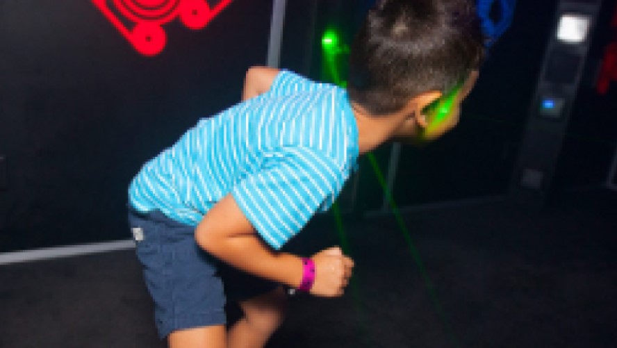 Young boy enjoying a laser tag game