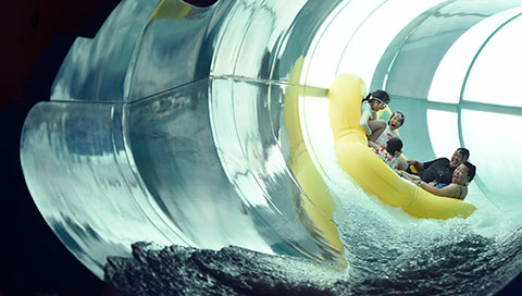 Family of five rides down enclosed waterslide 