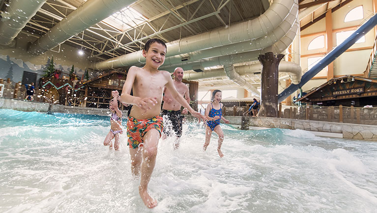 Children splash as they play in the Slap Tail pond at Great Wolf Lodge indoor water park and resort.