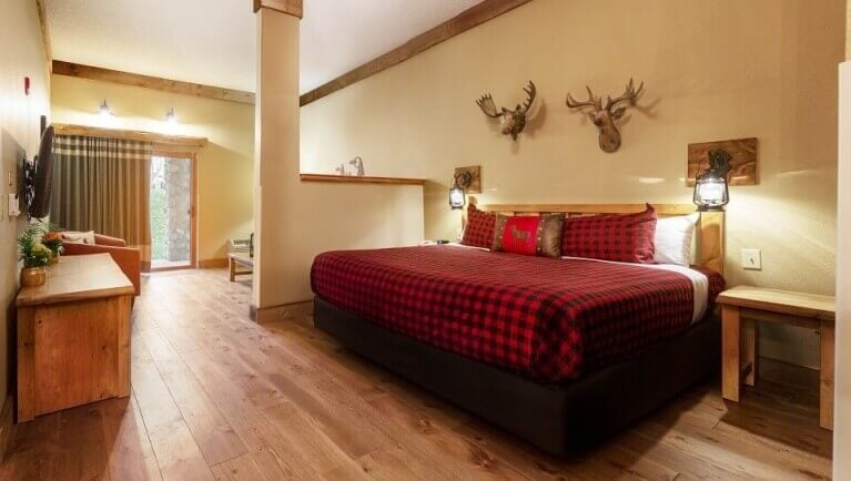 The king bed in the Accessible Woodland Bunk Suite 