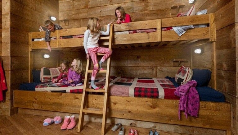 Kids hang out on bunk beds